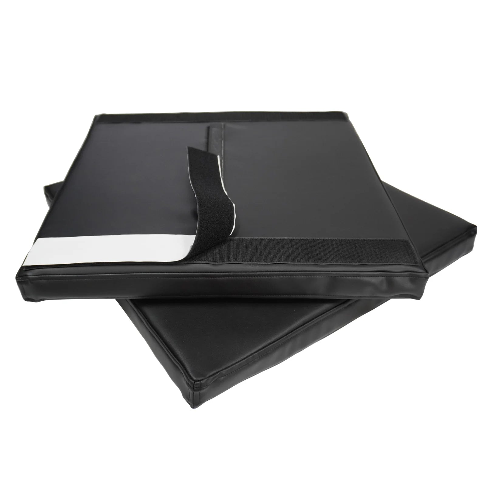 Two black rectangular padded mats stacked on a white background, with one mat showing a black strap and a white reflective strip.